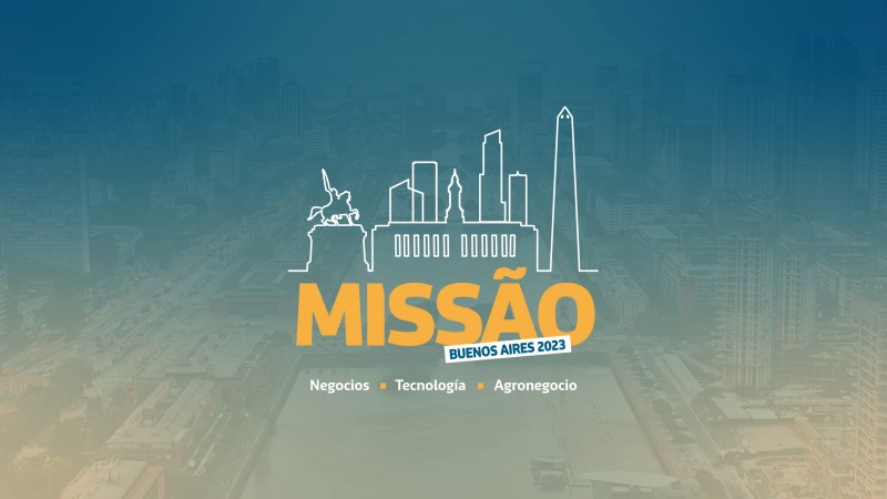 Card em fundo azul com um desenho ao centro em contornos representando locais que lembram a cidade de Buenos Aires. Logo abaixo está escrito Missão em letras amarelas com uma etiqueta branca pequena no canto inferior direito onde se lê Buenos Aires 2023.