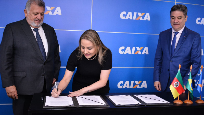 Assinatura de termo de cooperação com a Caixa